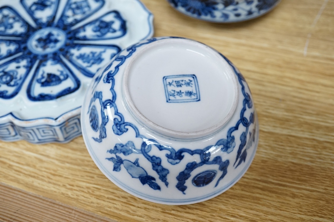 Two Chinese blue and white bowls and a lotus shaped tea pot stand, largest 15cm in diameter